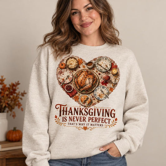 Woman wearing oatmeal sweatshirt with heart-shaped Thanksgiving dinner graphic and quote